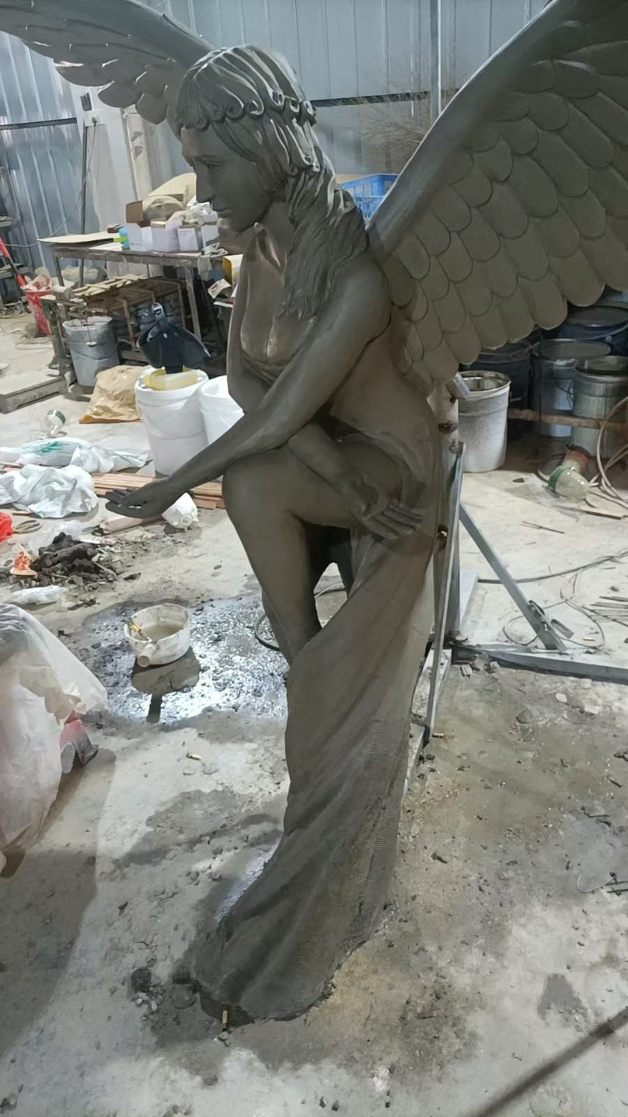 Fiberglass angel sculpture being fabricated in an AlisnArt workshop before finishing